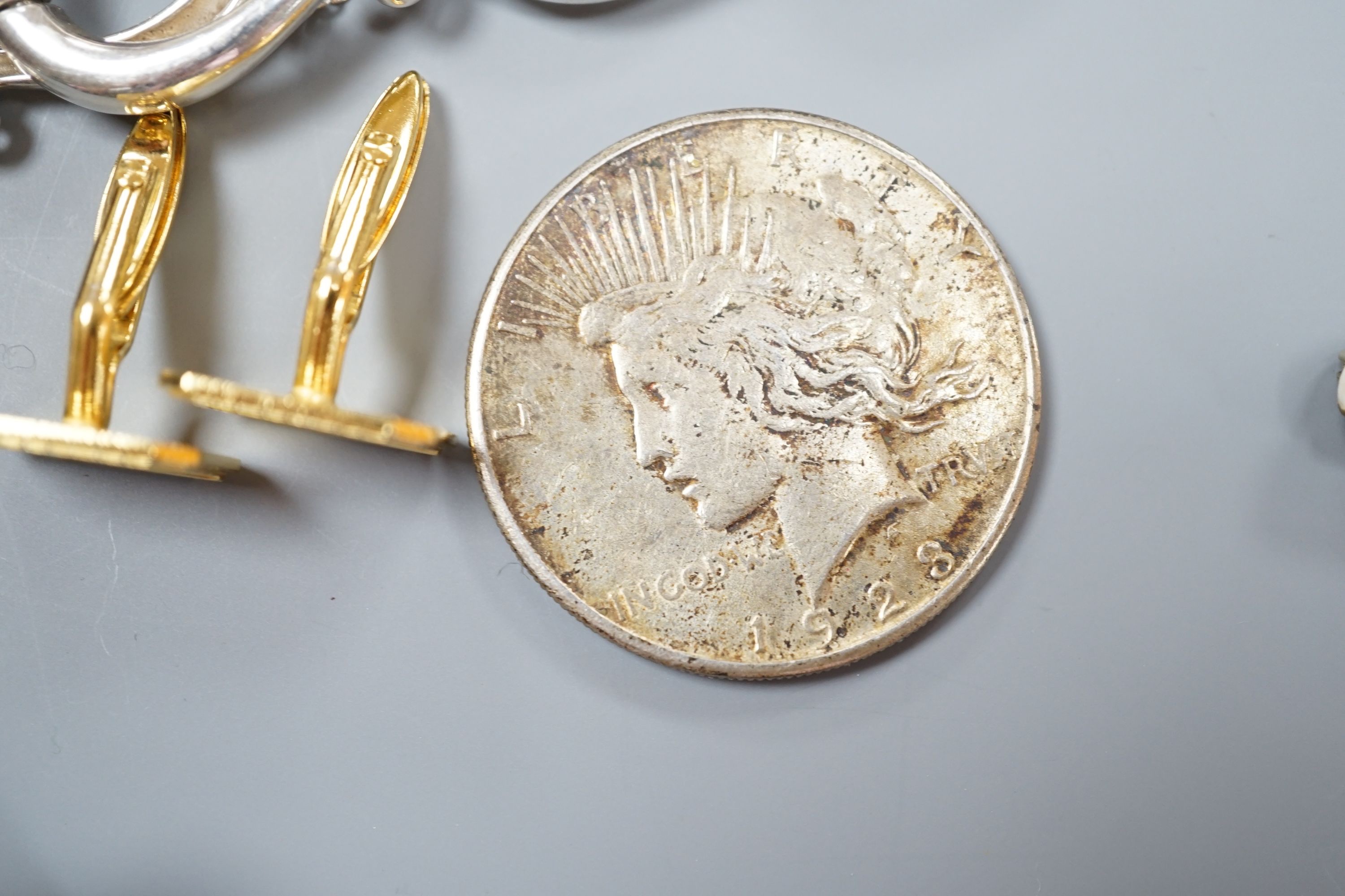 A white metal bracelet and minor jewellery and coins.